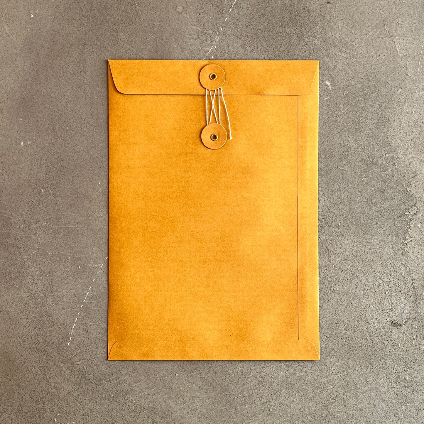 Thai orange string bound envelope